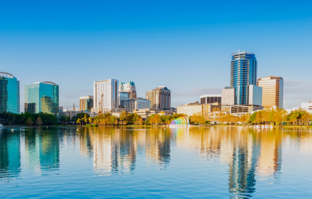 Orlando Lake Eola in the morning with urban skyscrapers and clear blue sky