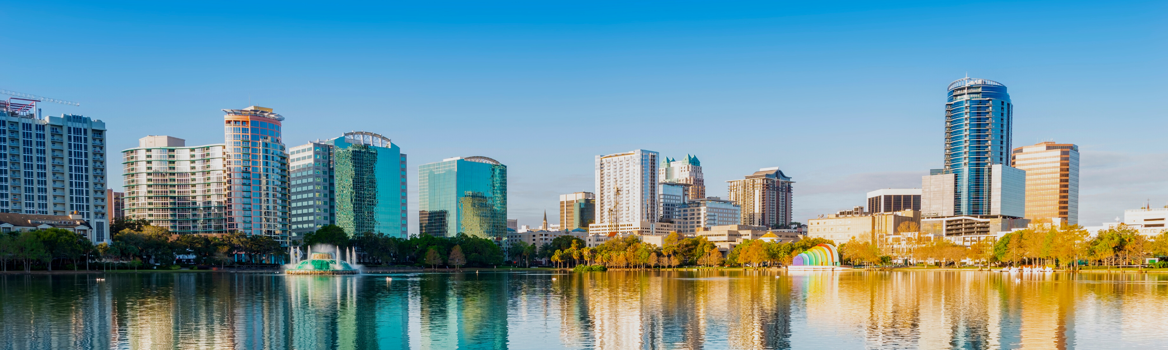 Lake Eola with urban landscape background in Orlando, Florida