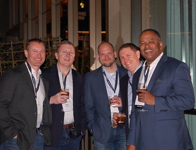 Five lawyers in dinner jackets smiling for the camera