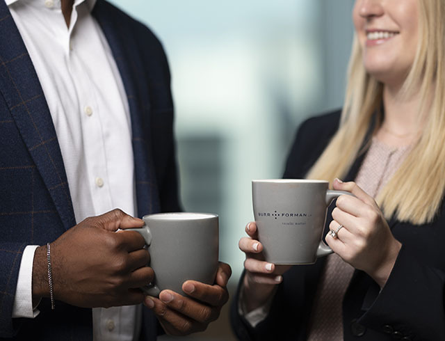 Two people chatting over a cup of coffee