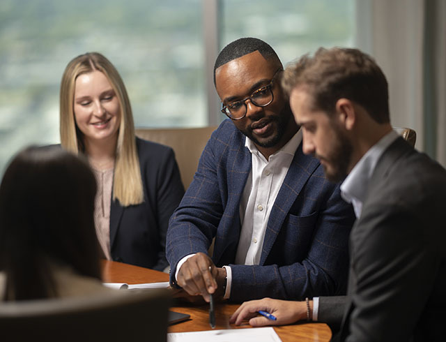 Lawyer in a meeting looking at computer